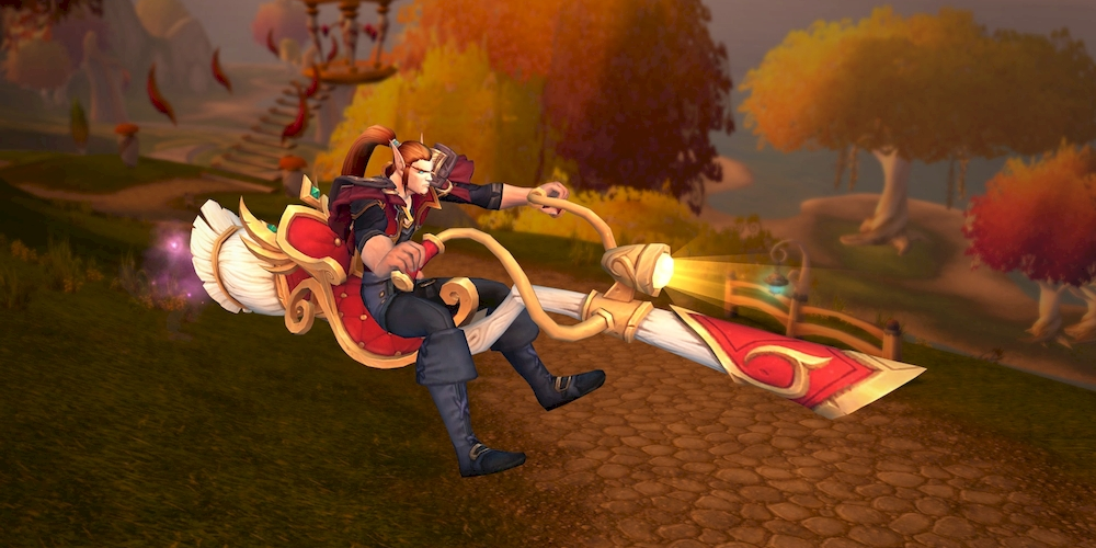 A male blood elf riding a Silvermoon Sweeper broomstick mount. The mount has Silvermoon red & gold detailing and seat over a broomstick made of white wood and with a white brush. The mount has golden handlebars with a headlight in the middle and a red plush seat - it